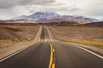 A highway passes through Death Valley National Park, California