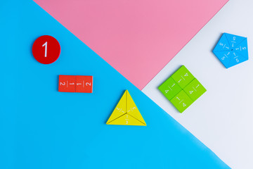 Colorful math fractions, numbers on blue pink white background. Interesting, fun mathematics for...