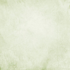 Abstract bright olive green stained paper texture with scratches background or backdrop. Empty old paperboard or grainy cardboard for decorative design element - obrazy, fototapety, plakaty