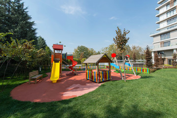 Obraz na płótnie Canvas Children's toys on the playground. Swing carousel in the park for children.