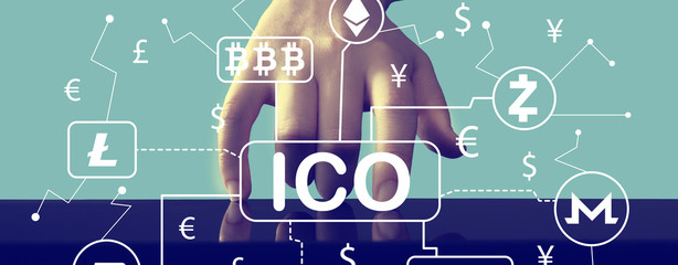 Cryptocurrency ICO theme with hand pressing a screen of a tablet computer