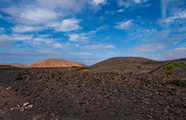 Amazing volcanic landscape of Lanzarote island, Timanfaya national park, Spain. October 2019