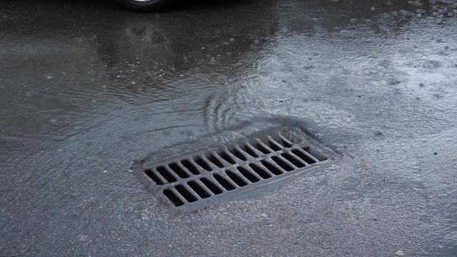 water drains into the sewer during rain through the iron grid