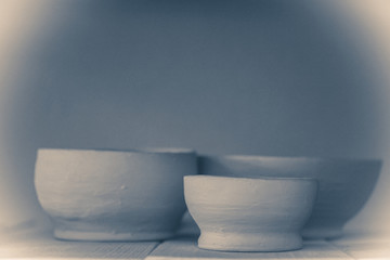 Fototapeta na wymiar Ceramic clay products stand on the shelf close-up.