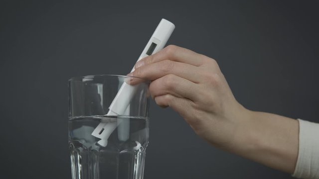 TDS check. Checking water quality using a test.