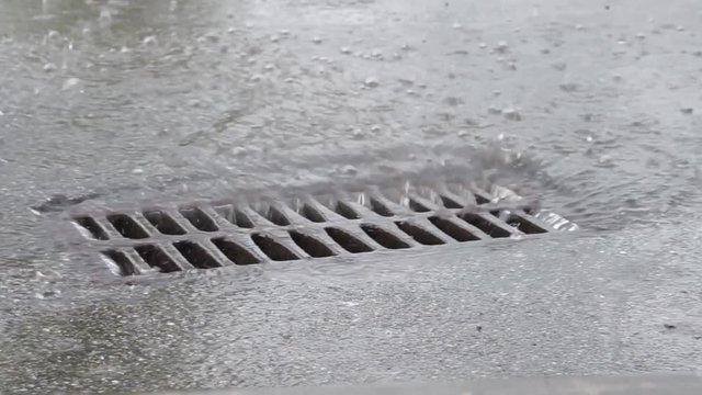 water drains into the sewer during rain through the iron grid