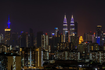Fototapeta na wymiar Buildings in Kuala Lumpur illuminated in blue lights for four nights from April 30 to May 3 from 10.30pm to 1am, in a solidarity campaign for Covid-19 front liners. 