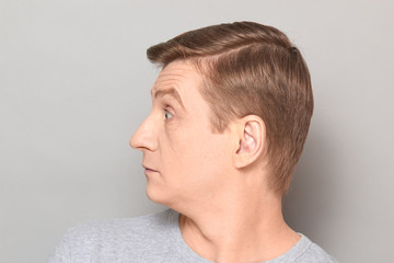 Fototapeta premium Portrait of blond mature man with surprised perplexed expression