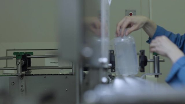 plastic bottles on Medical Solutions Conveyor . Blow fill seal technology technique used to produce liquid-filled container on medical or food industrial factory. medical industry