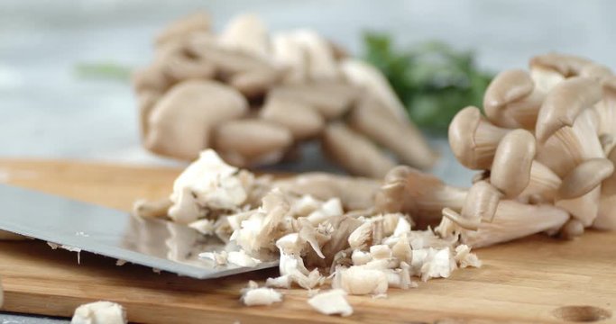 Sliced fresh mushrooms on the cutting Board slowly rotate.