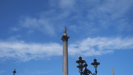 Time lapse. Admiral Nelson’s statue under the blue sky with moving clouds.