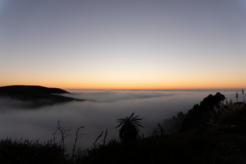 sunset over fog