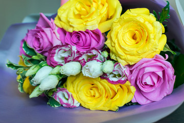 A bouquet of colorful roses on the table