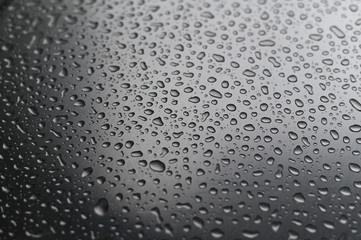 Close-up view of water droplets on a cold stainless steel surface