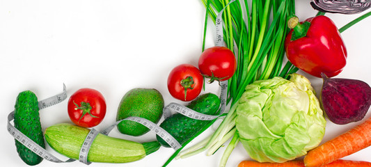 a set of vegetables and a tape to measure body volume, the concept of cleansing the body and healthy eating, vegetarianism and separate nutrition, diet and proper fitness nutrition, nutrition plan