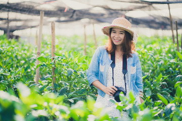 Portrait of asian woman smiling at the camera.