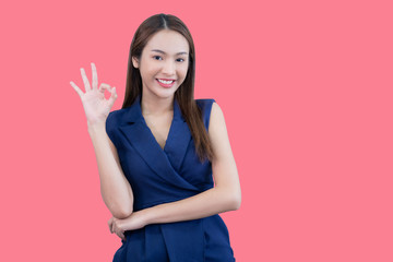 Fototapeta premium Portrait of beautiful woman in pink background.