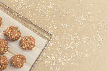 Obraz na płótnie Canvas Topview homemade oat cookies over baking tray