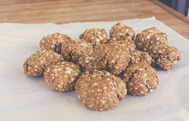 topview of homemade oat cookies on bakery paper