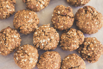 topview of homemade oat cookies on bakery paper