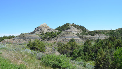 Fototapeta na wymiar Late Spring in the North Dakota Badlands: Buttes and Hills Along Scenic Loop Drive in the South Unit of Theodore Roosevelt National Park