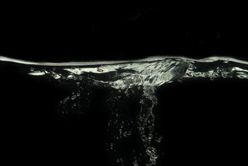 Bubbles on water surface with black background