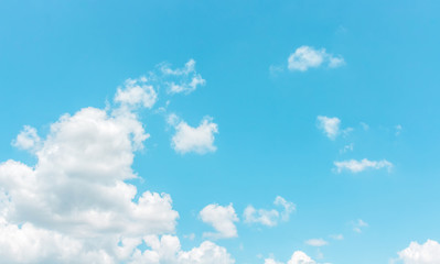 Light blue sky with bright clouds