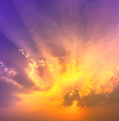 orange sunet light with violet and blue colorful light in dramatic sky with sun beam light