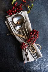 Autumnal table setting with wild red berries