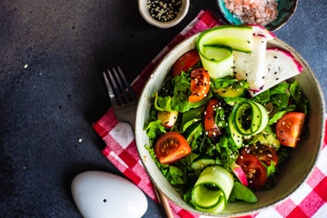 Healthy vegetable salad on rustic background