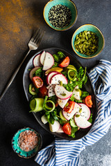 Healthy vegetable salad on rustic background