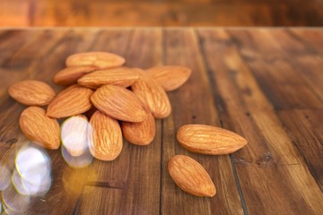 Delicious nuts with seeds on the wooden desk