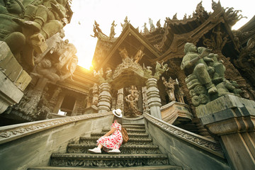 Woman tourist is sightseeing at Sanctuary of truth in Pattaya, Thailand. 