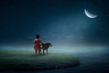 Obraz na płótnie Canvas หนูน้อยอยู่กับสุนัขบนดวงจันทร์อย่างโดดเดี่ยว