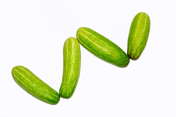 Fresh green cucumber on white background.