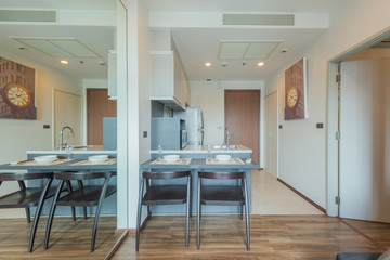 Stylish kitchen interior with dining table and chairs