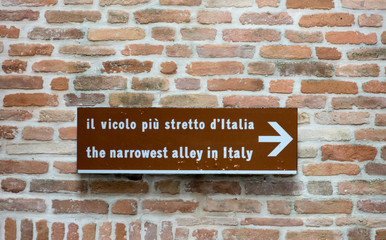 Acquaviva Picena a small village in Ascoli Piceno province, region Marche in Italy. the narrowest alley in Italy - road sign