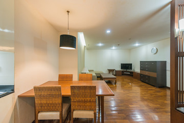 Stylish kitchen interior with dining table and chairs