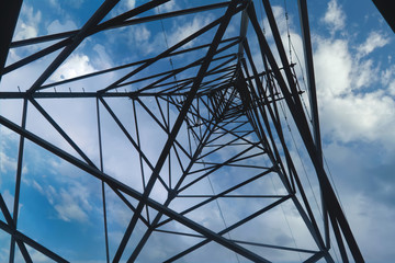 Power poles transmission line, Electricity high voltage pole, Electrical network. Bottom up view