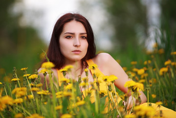 Beautiful Young Woman Outdoors. Enjoy Nature. Healthy Girl in Green Grass.