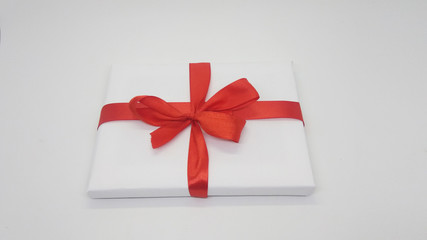 White Christmas Gift with Red Ribbon and Decoration Isolated on White Background