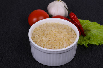 Raw uncooked rice in the bowl