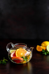Hot fruit tea with lemon, mint, orange, lime and grapefruit