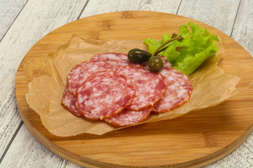 Fototapeta premium Spanish Salchichon sausage with salad