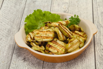 Grilled eggplant slices served basil