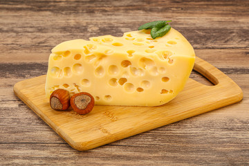 Maasdam cheese - yellow triangle with holes