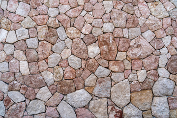 seamless stone wall made of natural stone, background and texture