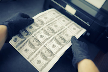 The concept of the global economic crisis. Illegal production of US dollars. Print money...