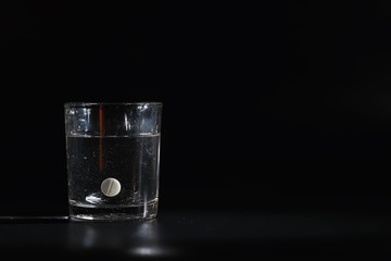 Water soluble tablets. The medicine is soluble. Anti-hangover. Effervescent tablets in a glass.