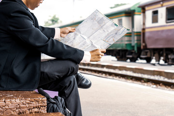 businessman examining map searching looking locating for destination place to travel to, traveling...